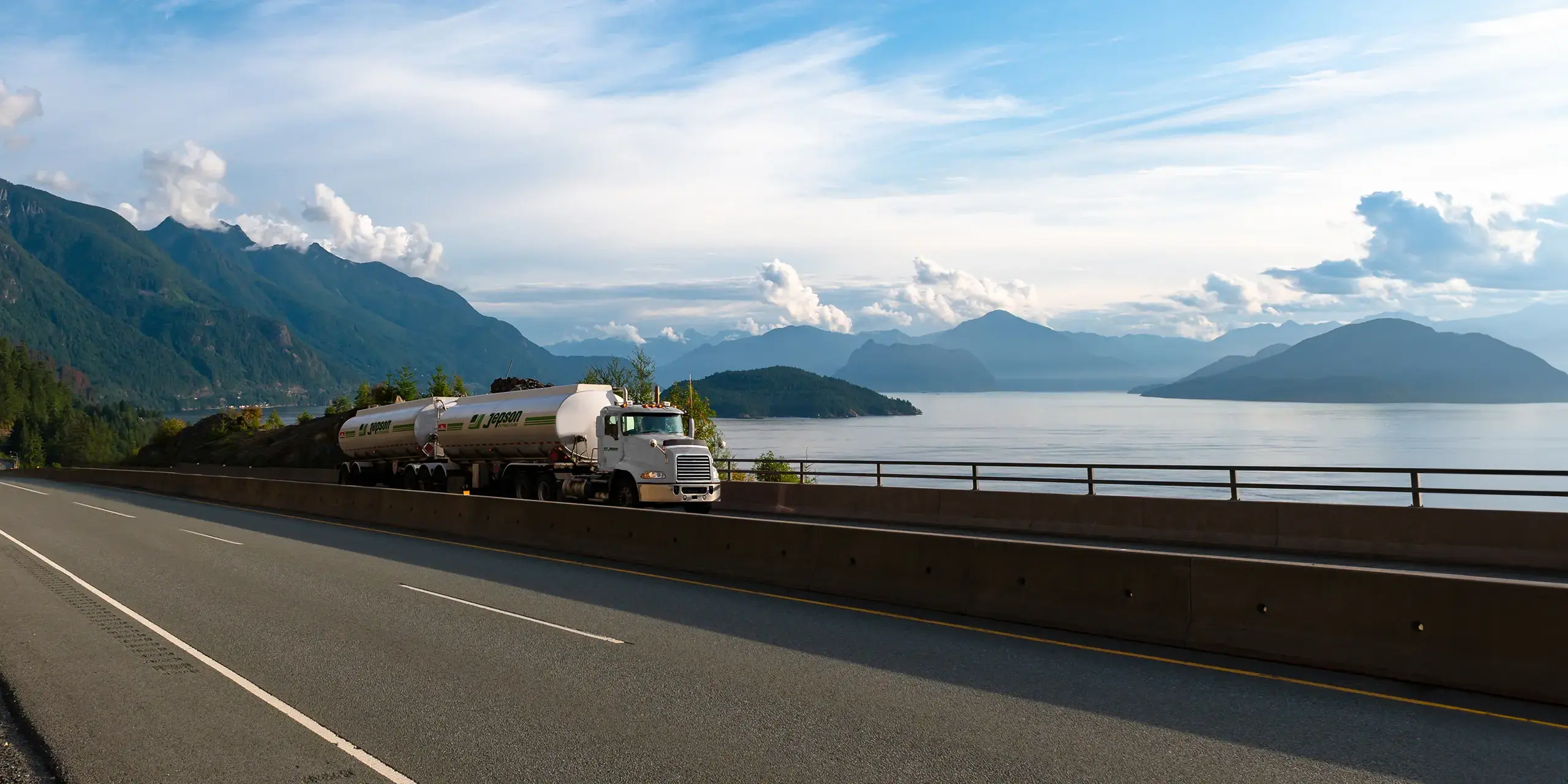 Jepson truck driving down a highway by the ocean